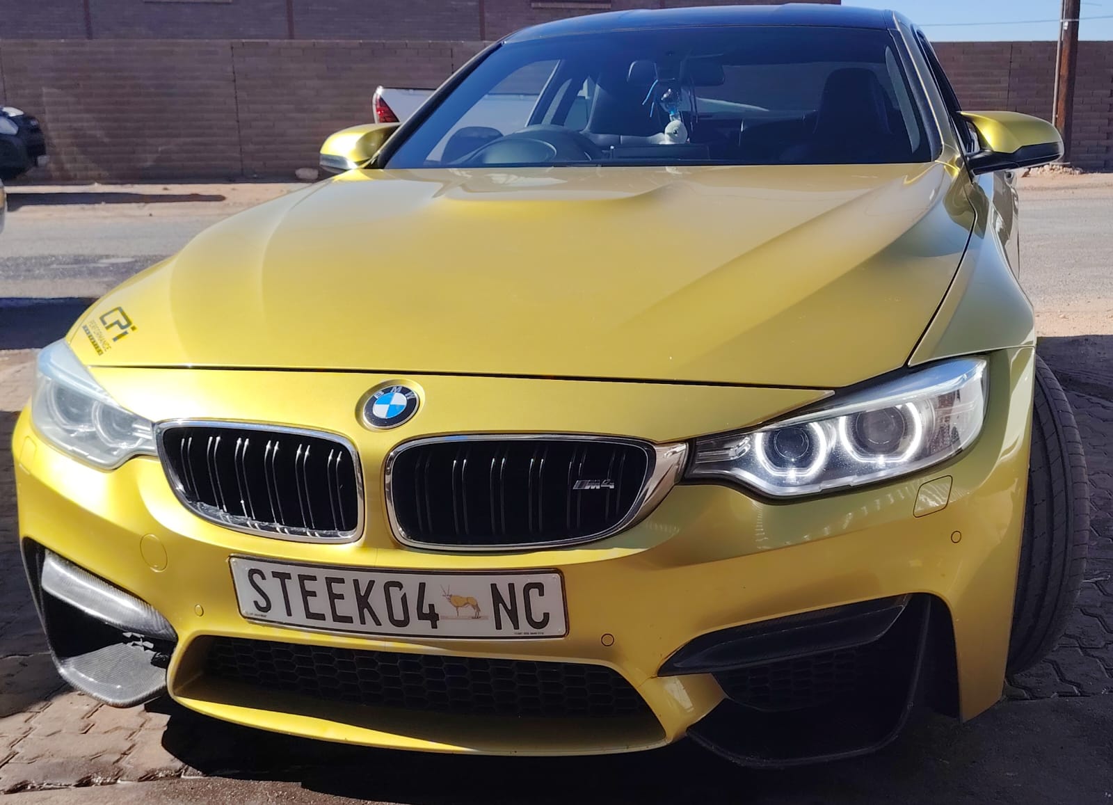 Yellow BMW M4 at Auto Fitment Centre