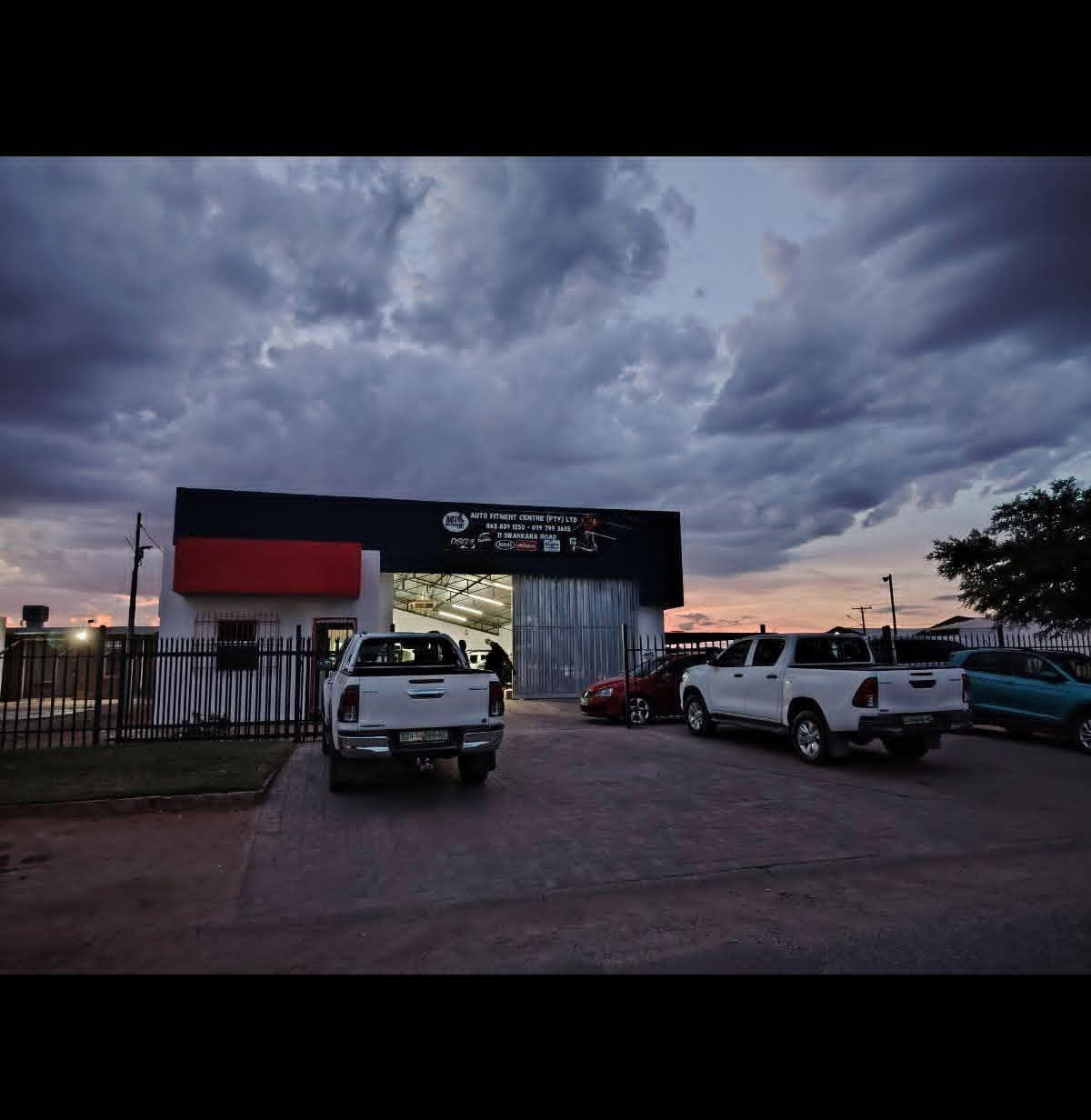 Auto Fitment Centre building at 11 Swakara Road at dusk